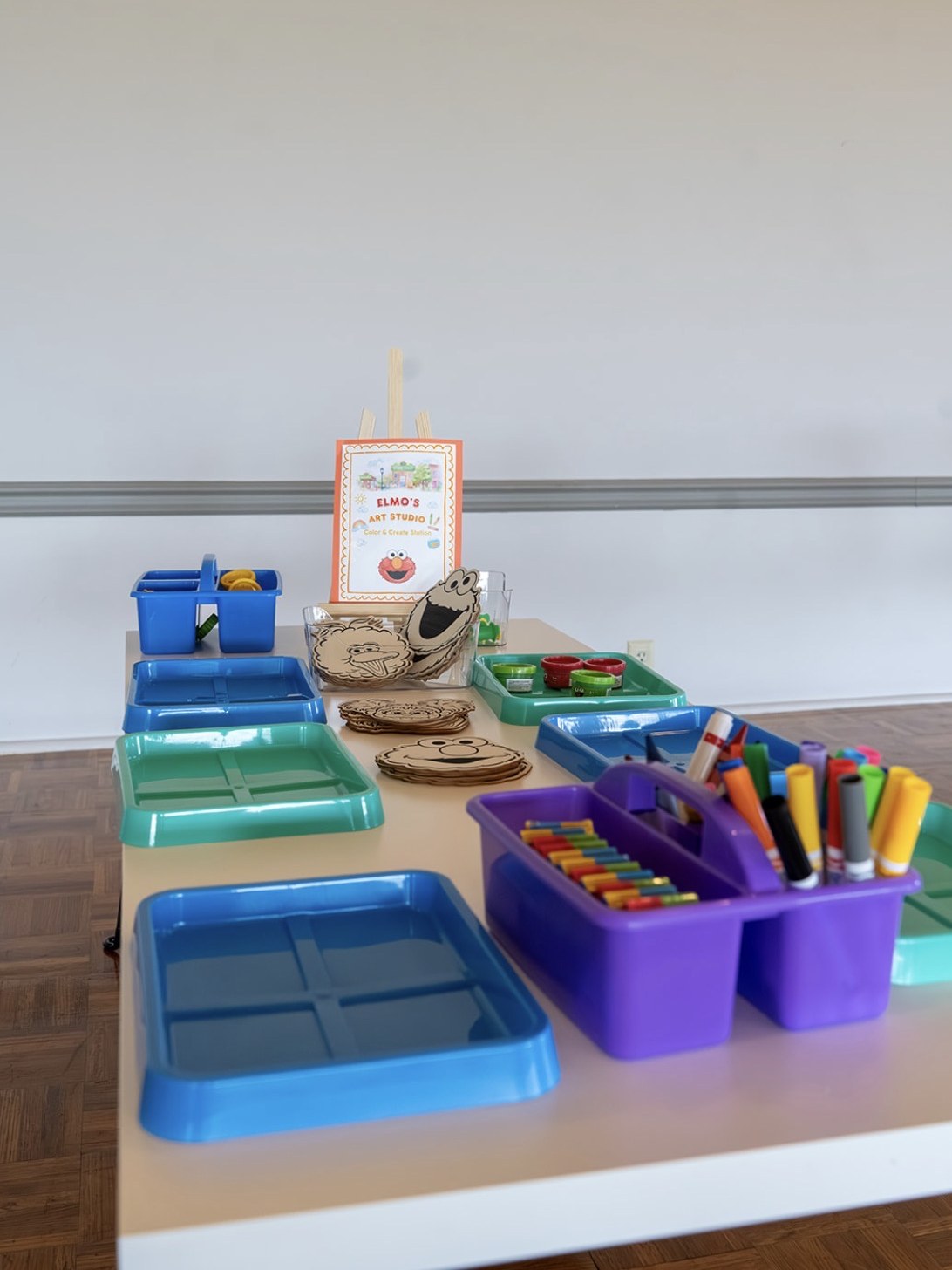 Kids craft table set up with art supplies